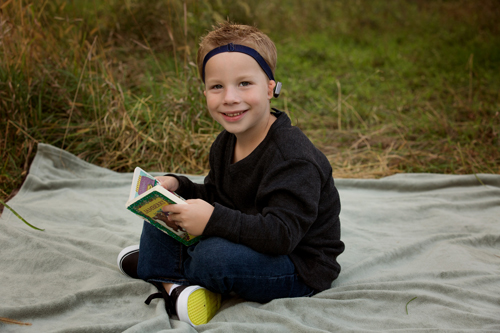 Softband holds boy’s bone conduction hearing aid in place