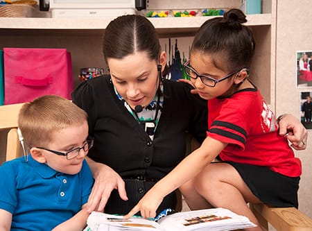 Hearing Aid Boy Reading Book