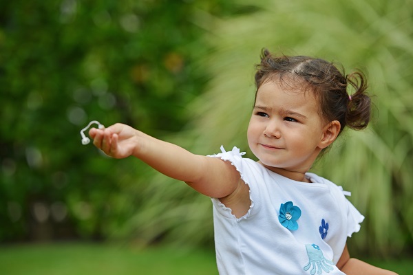 Child pulls hearing aid out of ear 